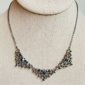 Downton Abbey silvertone segment necklace with dark gray iridescent rhinestones